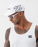 Angled side view of the white Nexletica Perform Hat showing the mesh panels and breathable build