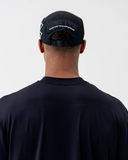 Back view of the black Nexletica Perform Hat showing the "Embrace Your Difference" print and adjustable strap