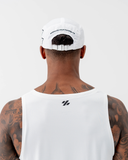 Back view of the white Nexletica Perform Hat showing the "Embrace Your Difference" print and adjustable strap