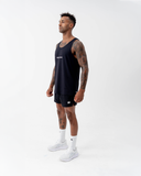Full-length side view of the black Nexletica Men's Perform Running Singlet styled with shorts and running shoes