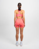 Coral Nexletica Impulse High Neck Sports Bra on model designed for high impact support and luxury performance