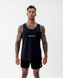 Man wearing the Nexletica Men's Perform Running Singlet in black, front view, with the NEXLETICA wordmark across the chest