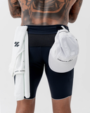 ack view of the black Nexletica Men's Perform Running Tights styled with a singlet and running cap