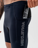 Side-back view of the black Nexletica Men's Perform Running Tights showing the logo and silicone hem gripper