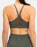 Back view of Synergy Sports Bra in Khaki with mesh racerback and Nexletica logo