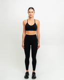 Full front view of model wearing Nexletica Synergy leggings 